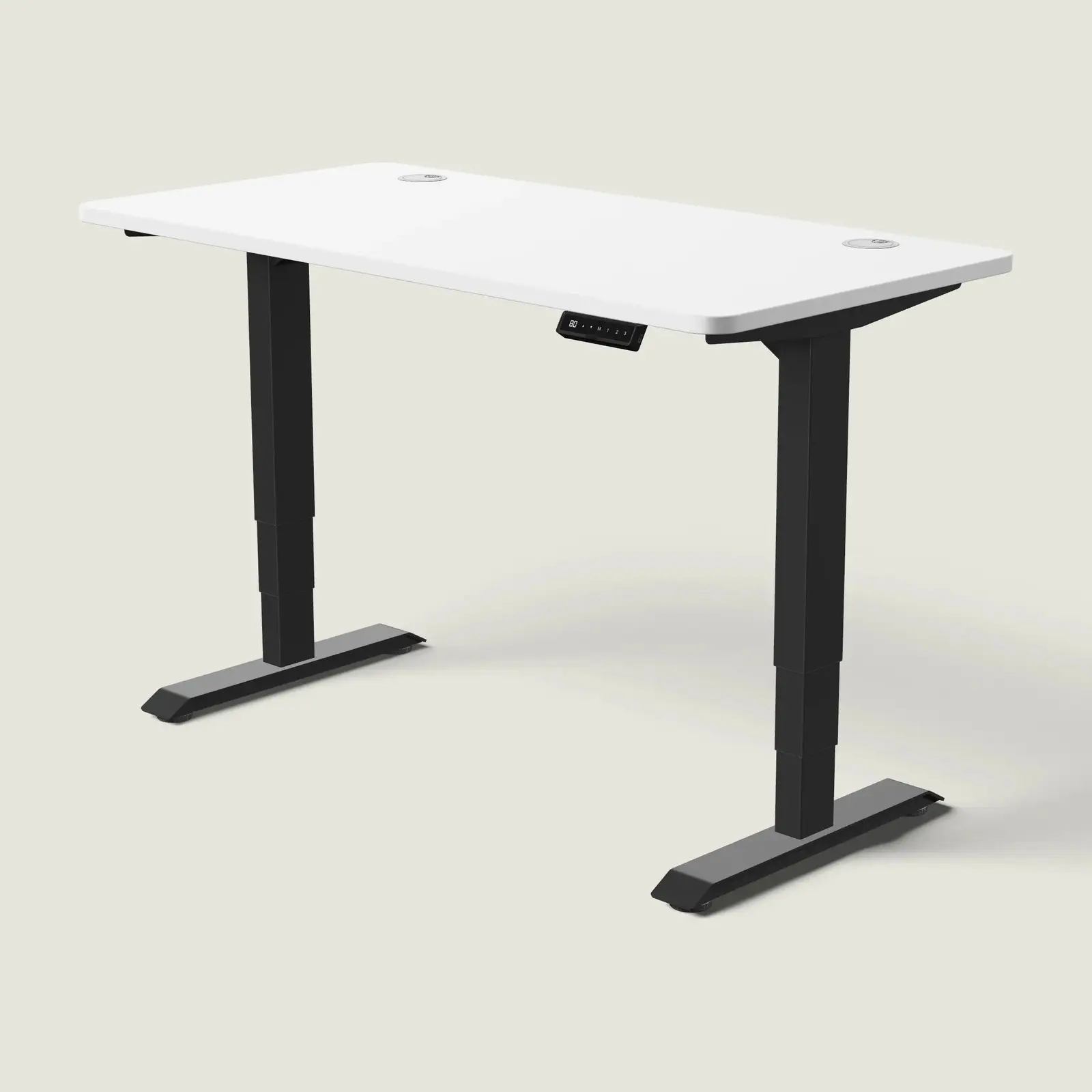 Electric standing desk, 140 × 70 cm, black frame and white top, with the memory handset under the front edge, on a pale grey background
